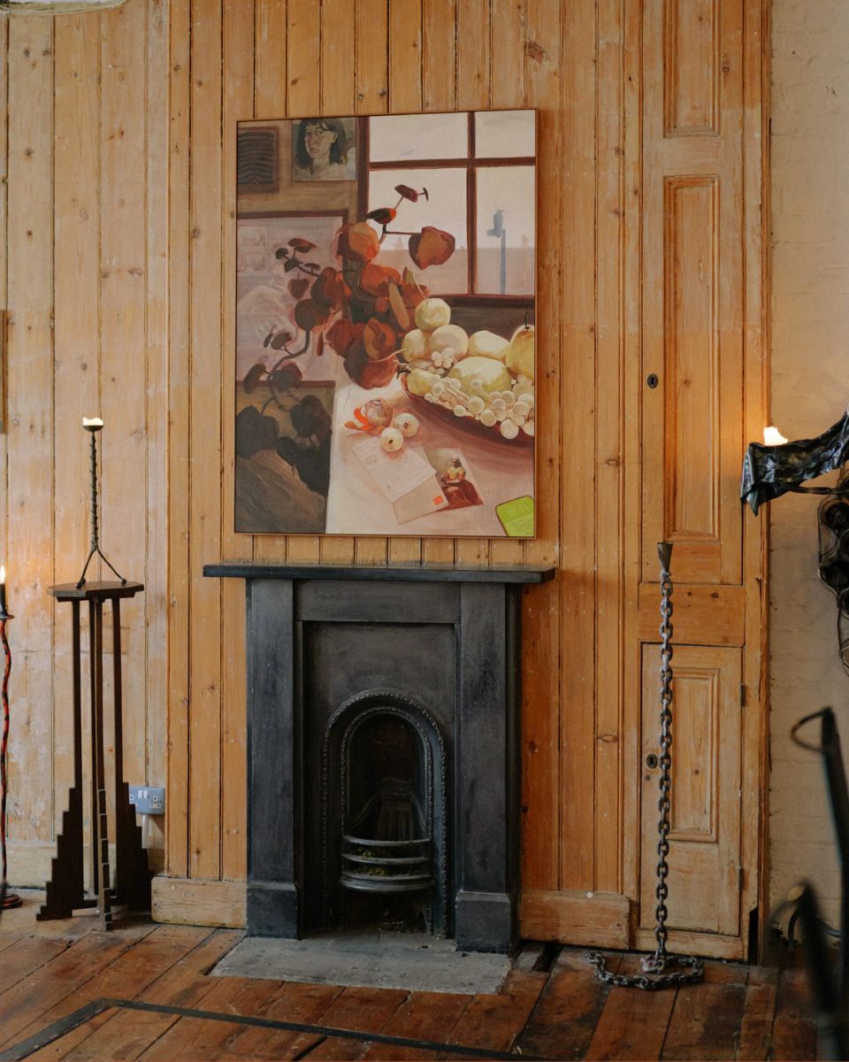 Sophie Glover contemporary floral still life painting mounted above a fireplace for the Emblems exhibition at Partnership Editions.