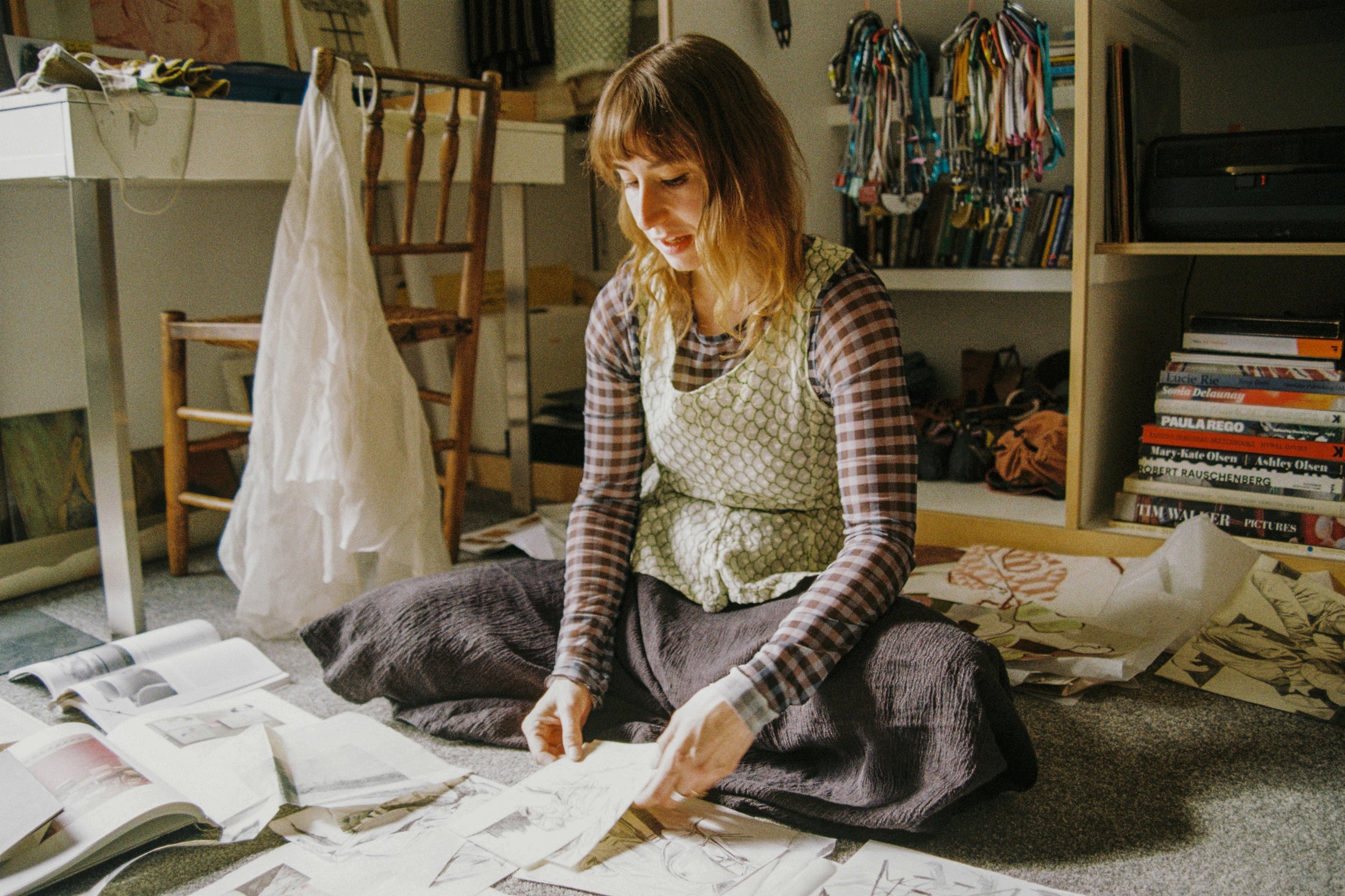 Artist and tailor Sophie-Nicole Dodds working with textile fragments and drawings in her studio for Partnership Editions.