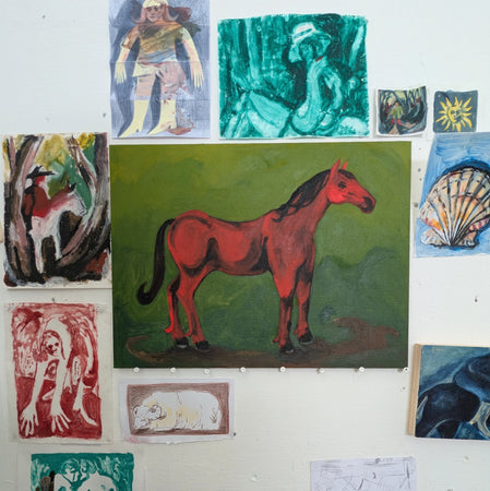 The red horse poses
