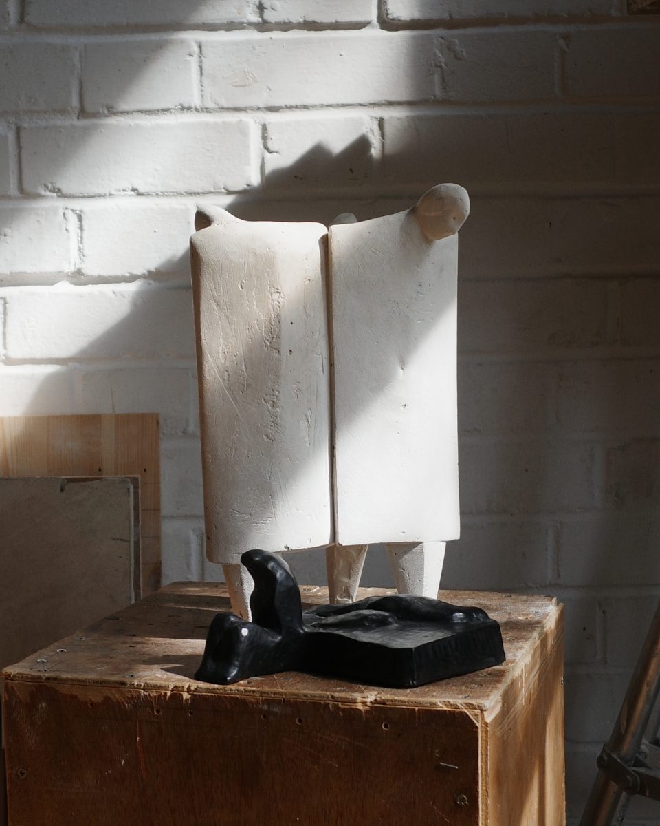 Detail shot of small sculptural figurines inside artist Thomas Merrett's workshop
