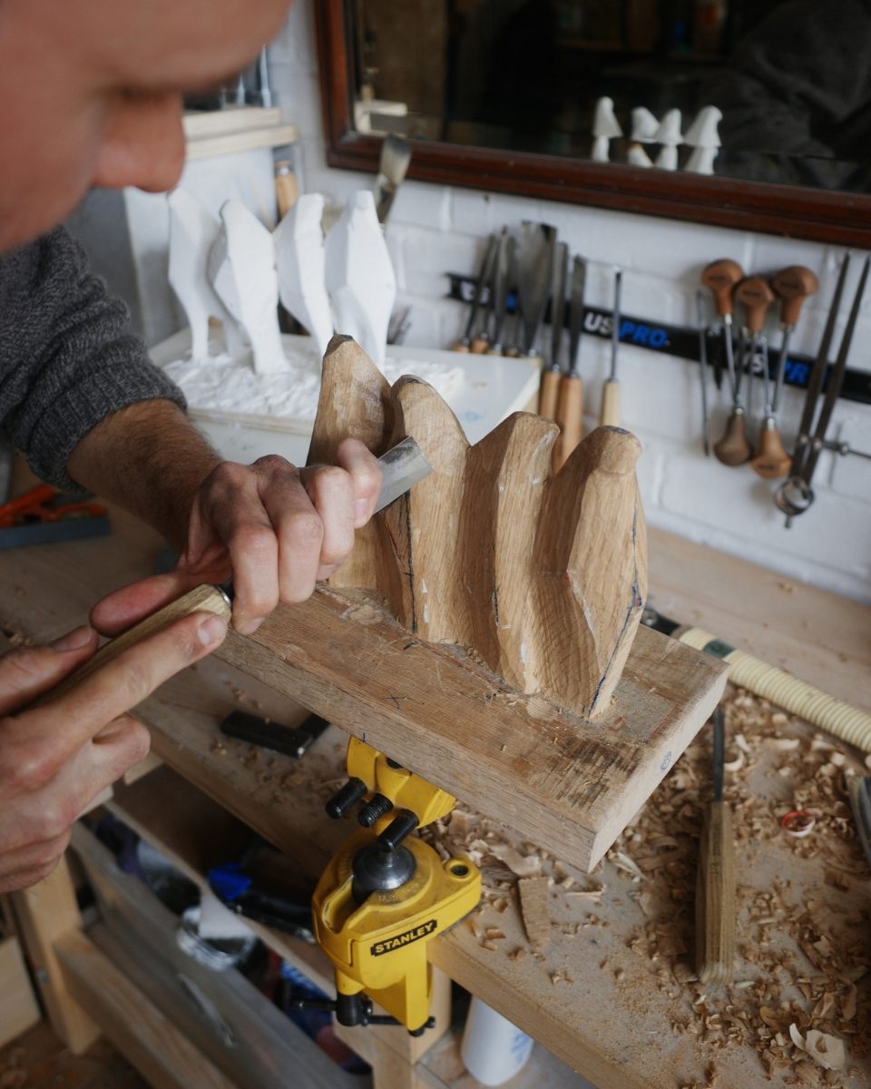 Thomas Merrett’s wood carving process, showcasing craftsmanship for Partnership Editions.