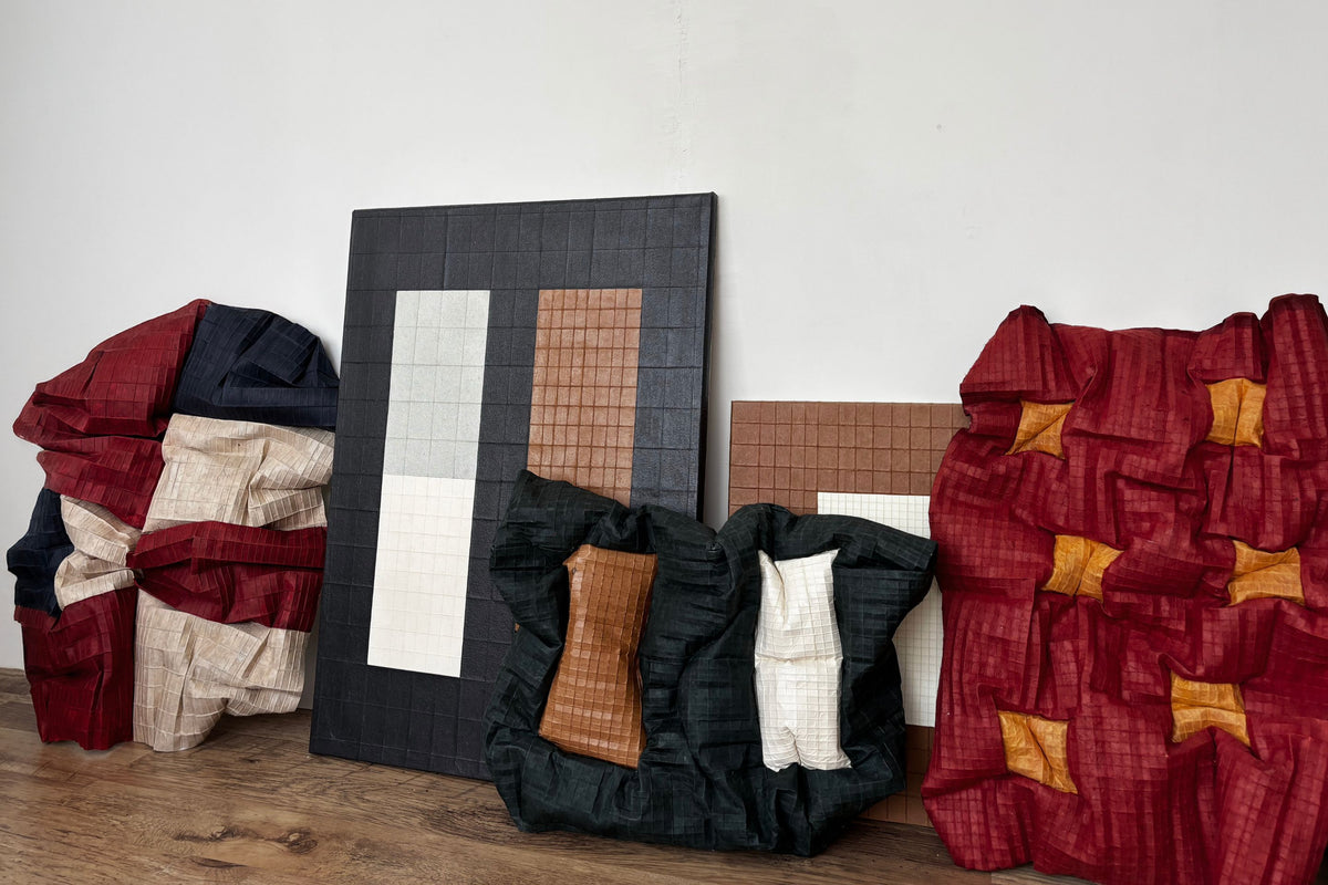 Tom Collison collection of textured paper and grid canvas artworks arranged against a white wall for the September 2026 drop at Partnership Editions.