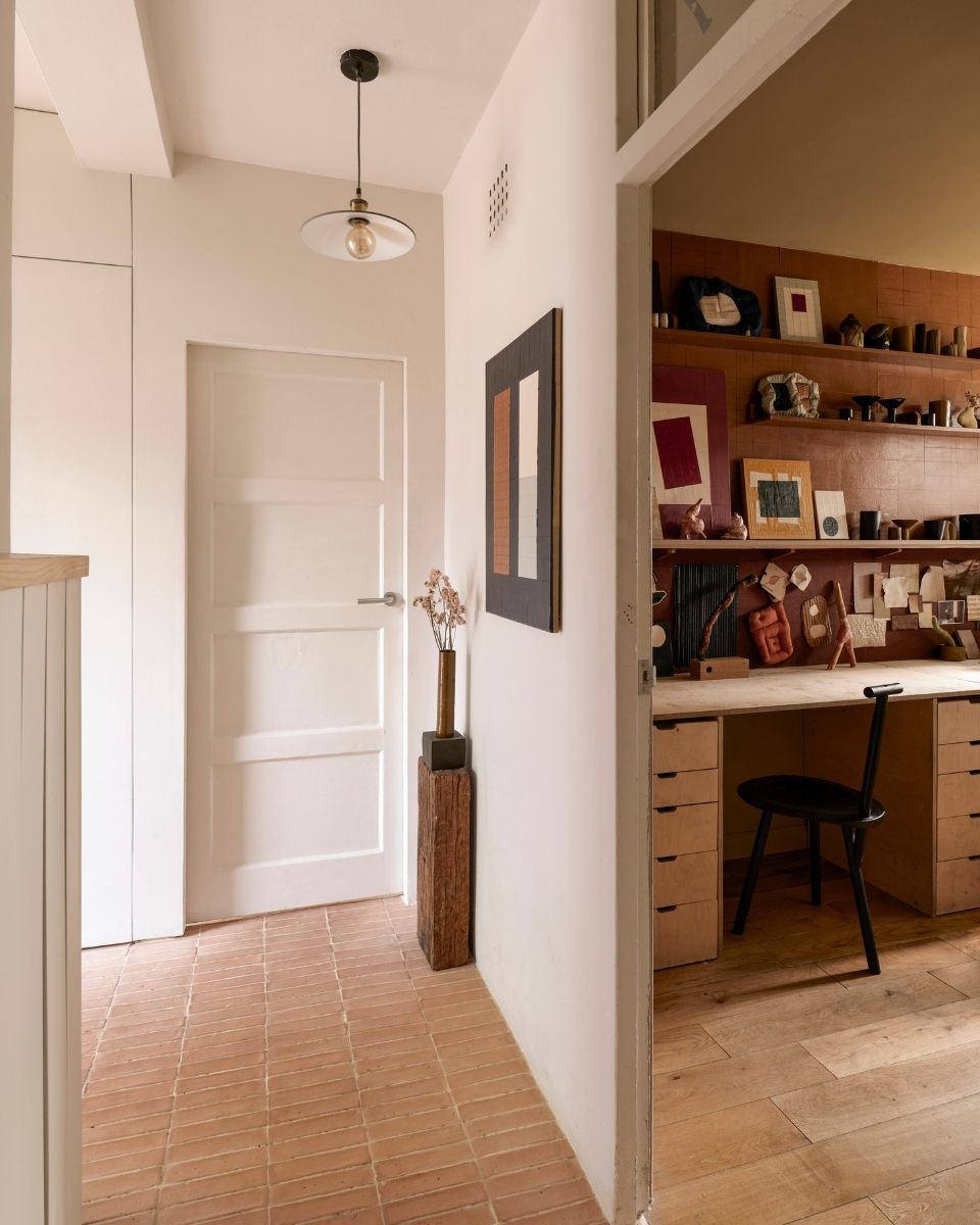 The entrance to Tom Collison’s London studio, featuring a mid-scale abstract work mounted on a minimalist white wall.