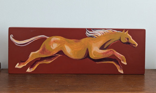 Yellow horse gallops