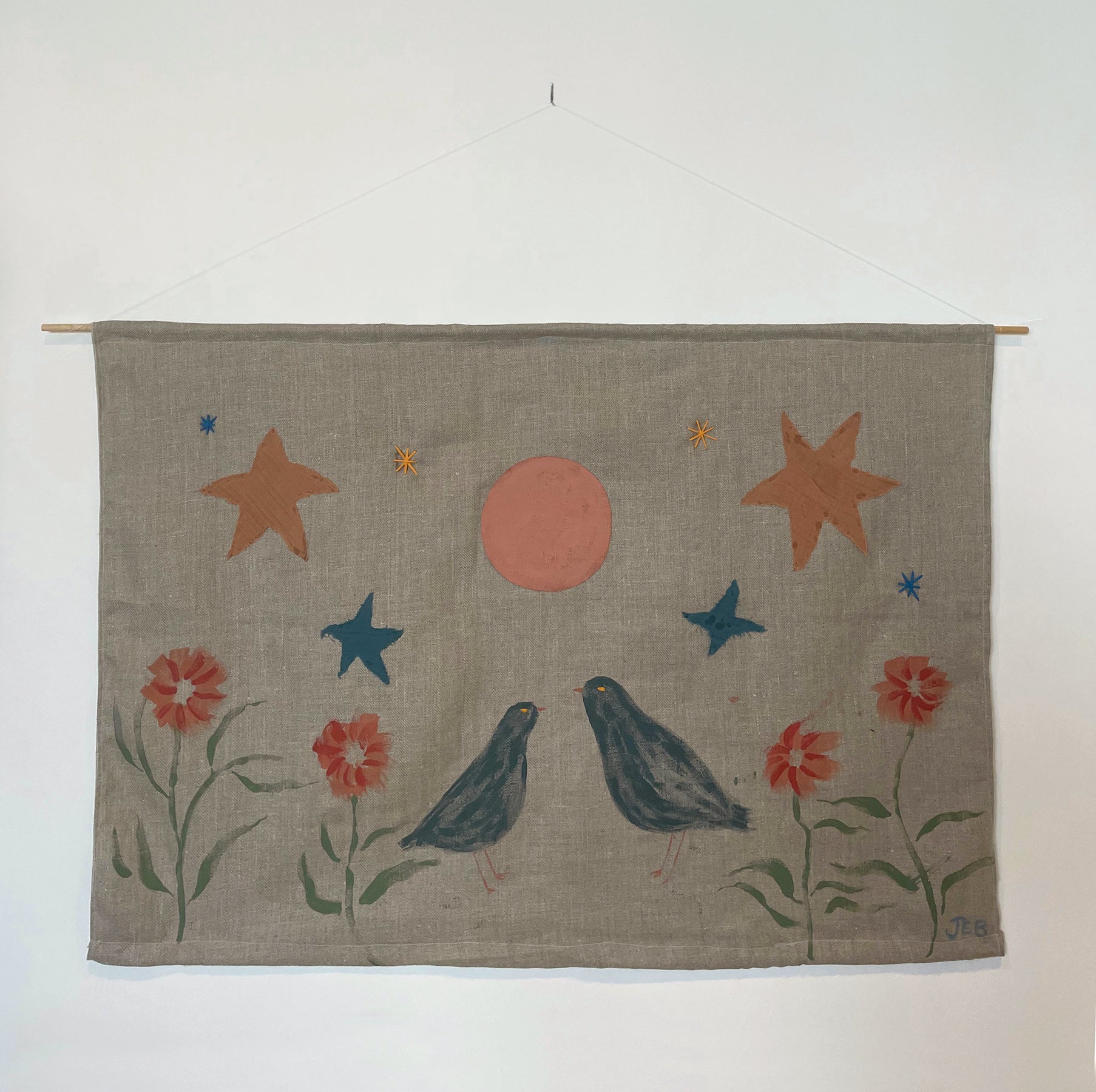 Playfully designed wall hanging by the rising artist Julianna Byrne titled Blackbirds and Dahlia Moon.