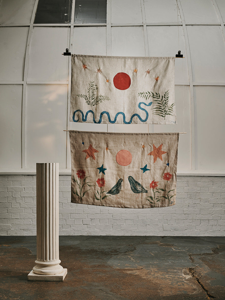 Emerging artist Julianna Byrne's two hand made wall hangings with botanical and animal details.