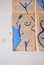 Load image into Gallery viewer, Figurative artwork painted in blue on book pages by the talented artist Laxmi Hussain.