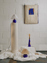 Load image into Gallery viewer, Photograph of rising artist Laxmi Hussain&#39;s homeware collection, containing her figurative hand painted wooden lamp titled Elegant Transition 2.