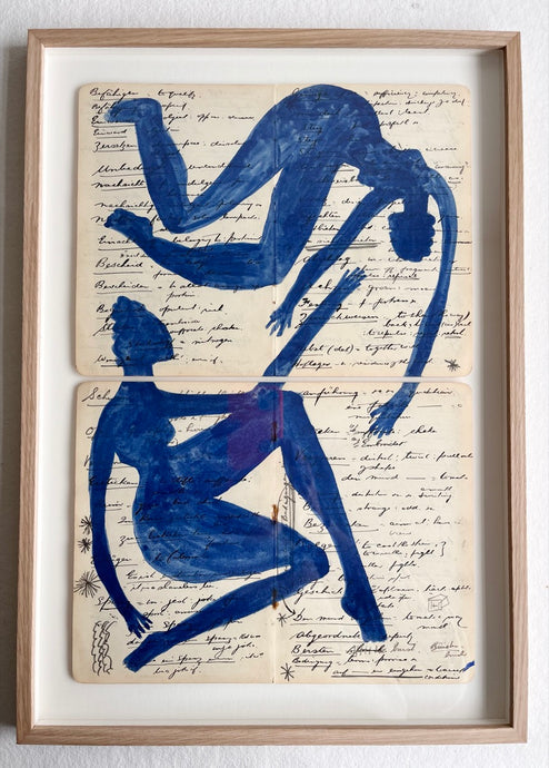 Two blue figures puzzle on English German notebook (Framed)