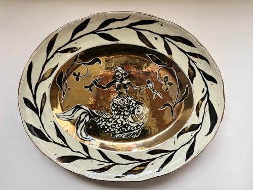 Woman with fish platter