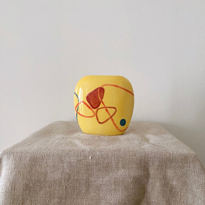 Yellow small oval-shaped pot